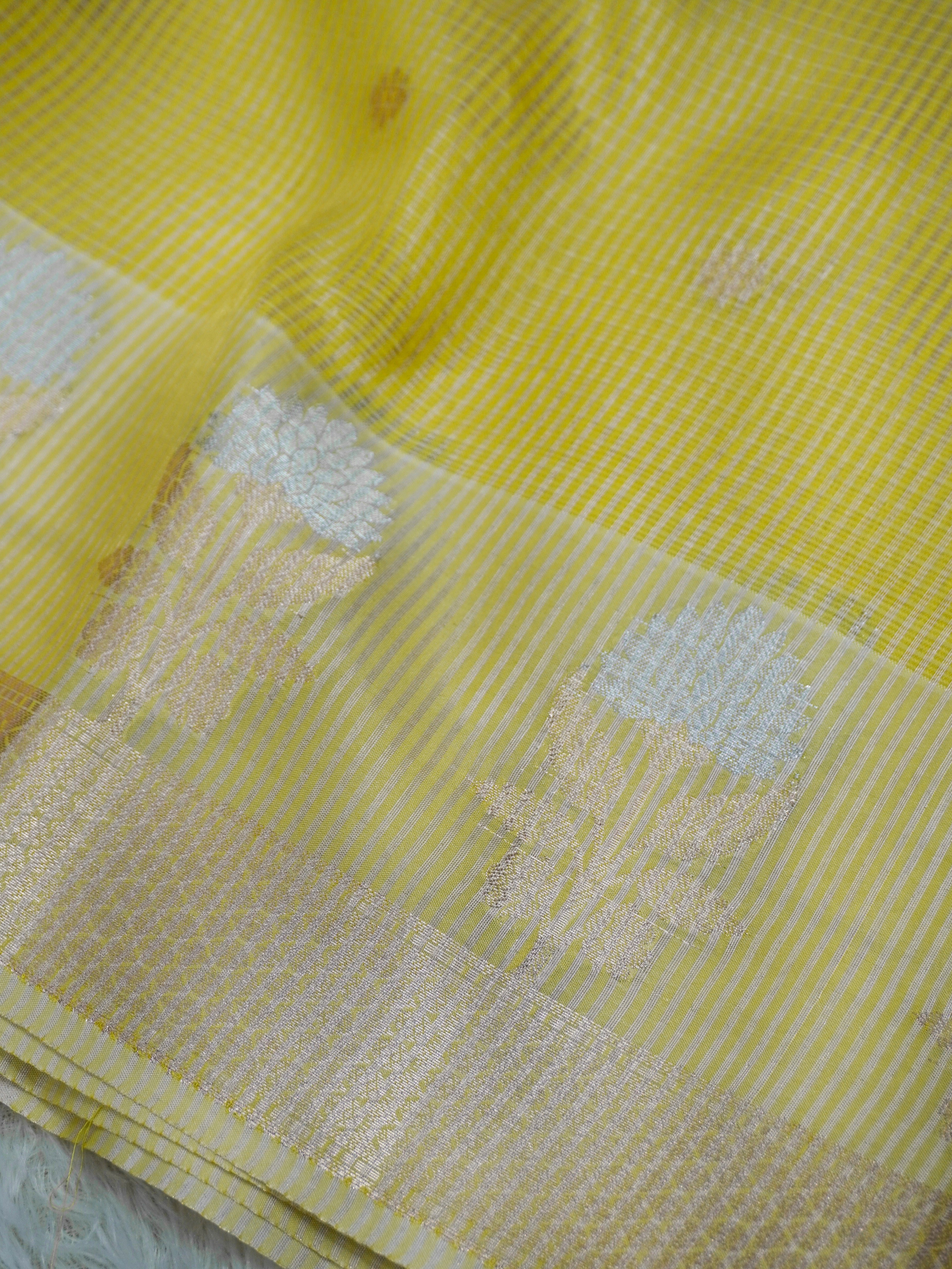 Lemon Yellow Tissue Banarasi Saree with Floral Buti & Silver Zari Border