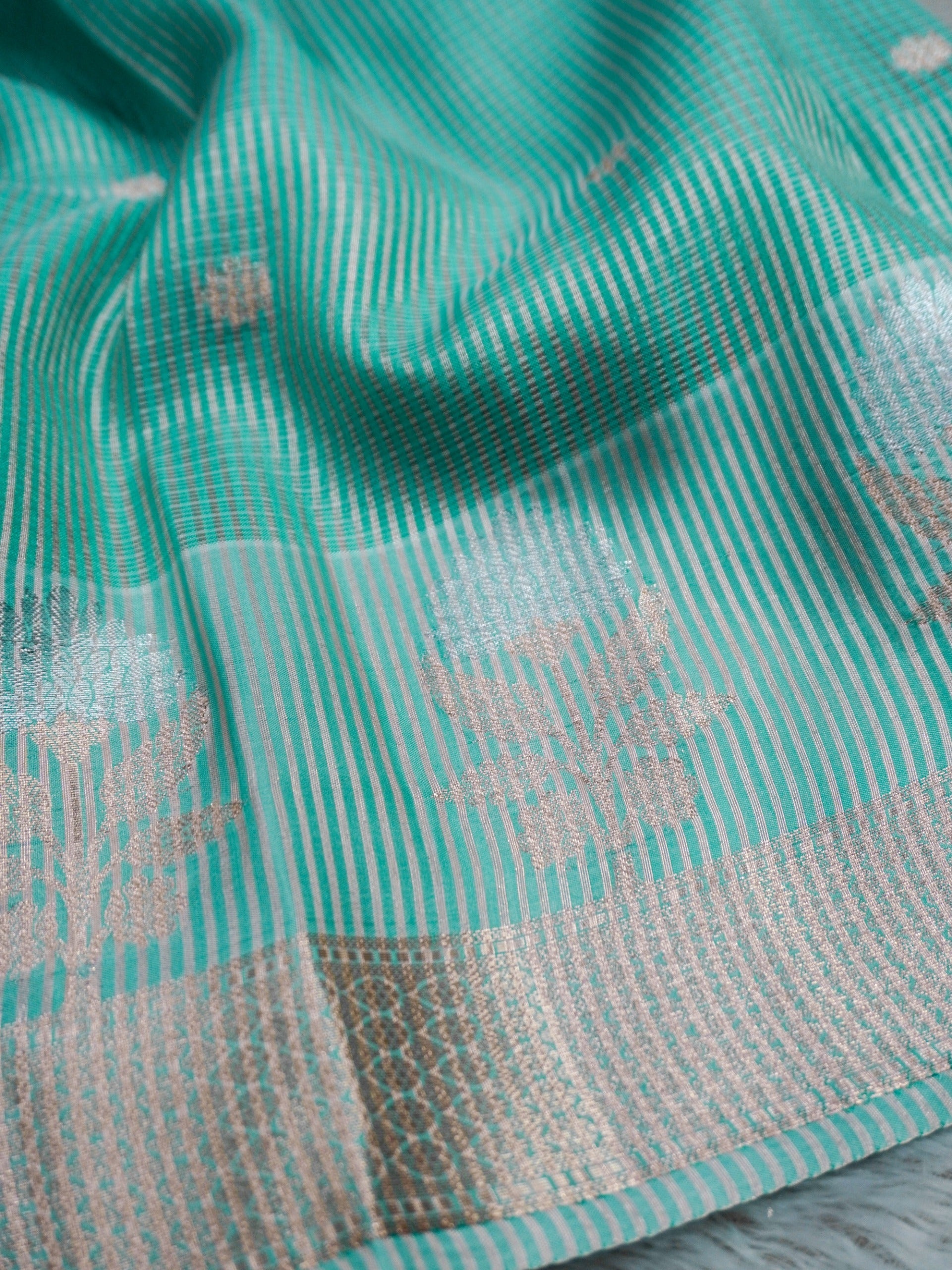 Aqua Green Tissue Banarasi Saree with Floral Buti & Silver Zari Border