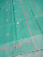 Mint Green Tissue Banarasi Saree with Floral Buti & Silver Zari Border