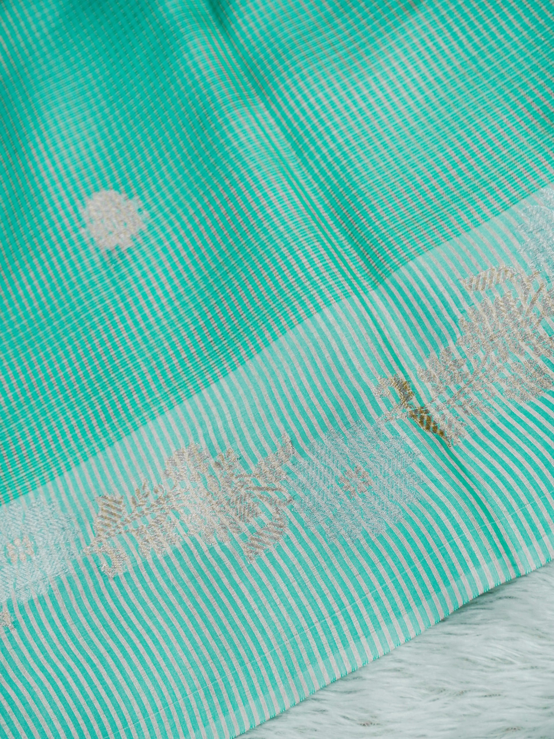 Mint Green Tissue Banarasi Saree with Floral Buti & Silver Zari Border